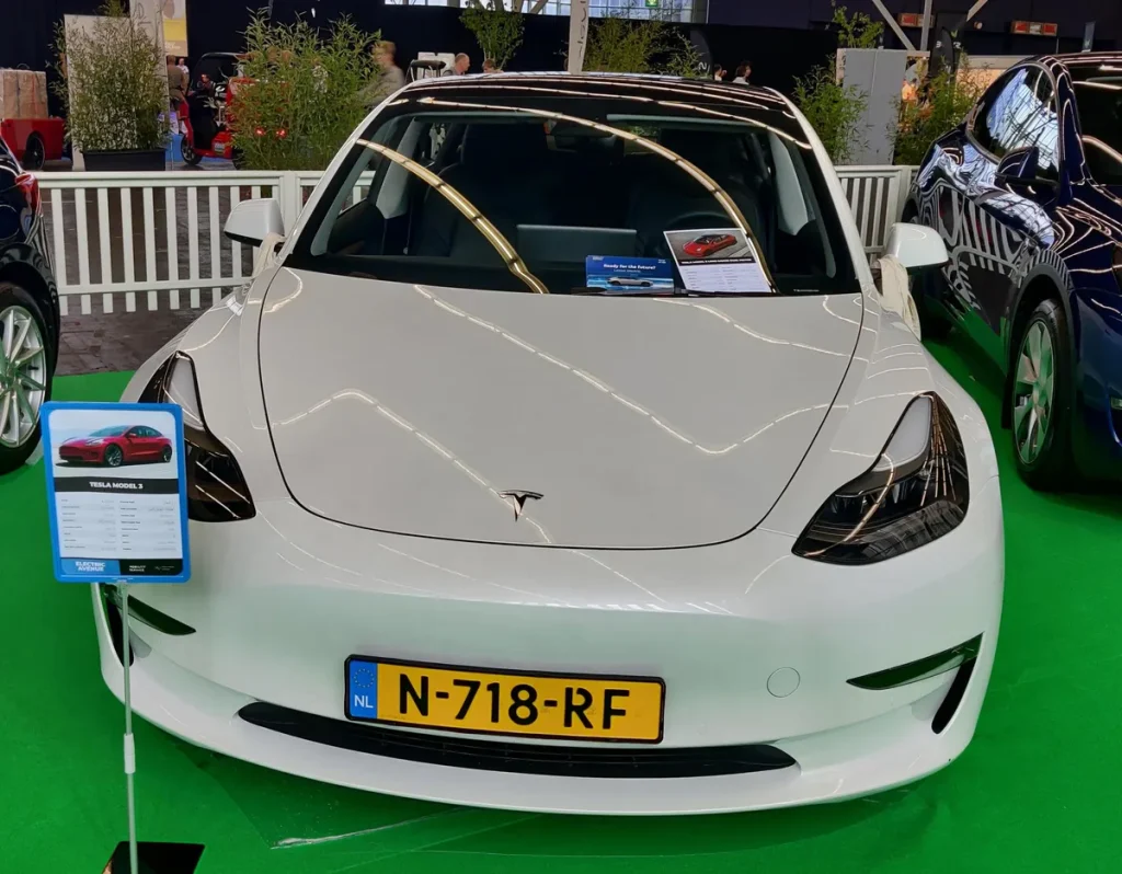 Tesla Model 3 electric car front view at Fully Charged Amsterdam - Tesla verzekering 2026